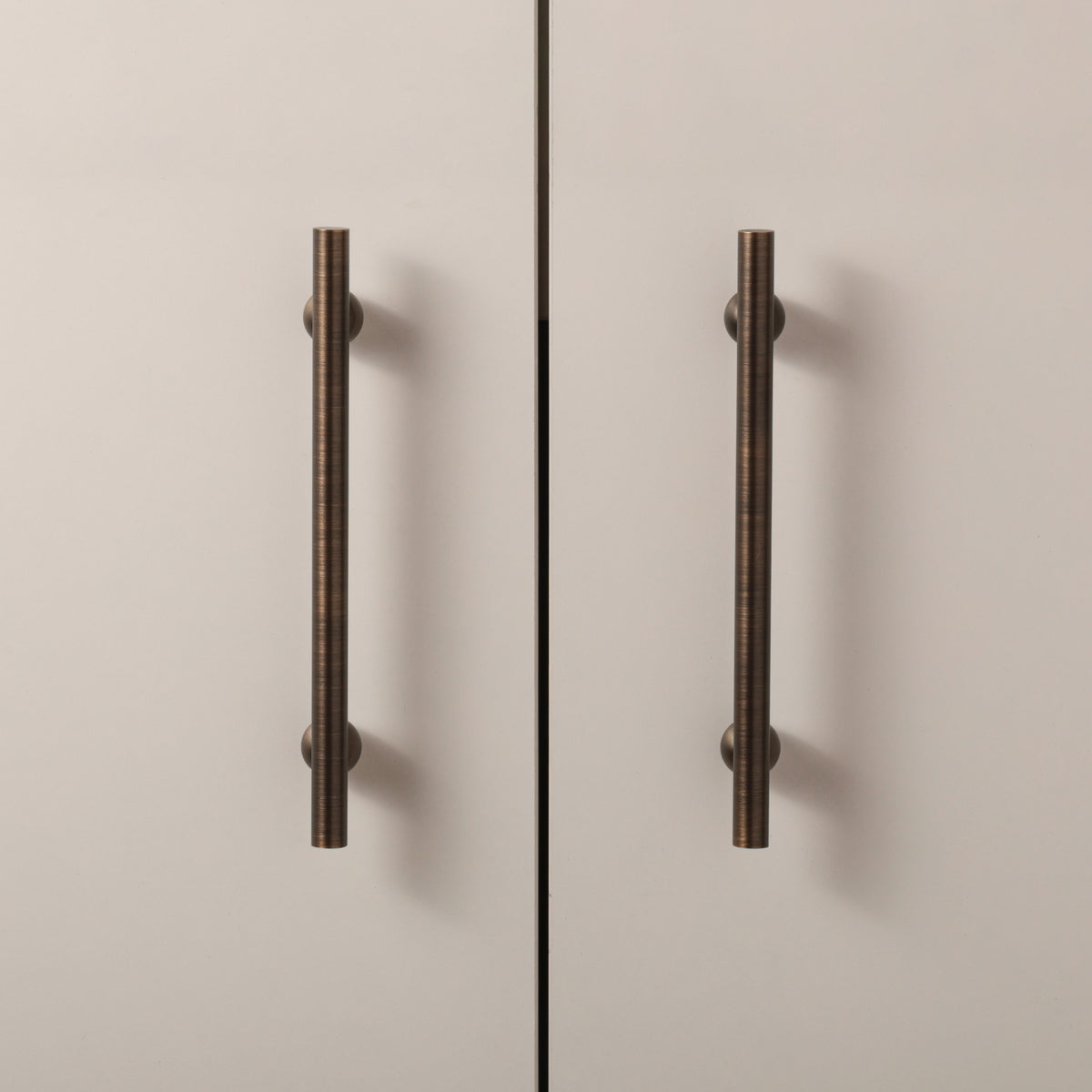 Flair Handle in Antique Brushed Bronze installed on cabinet doors