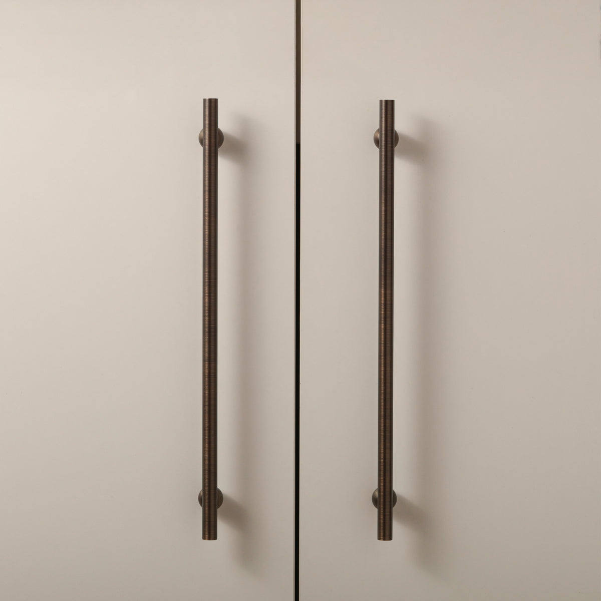 Flair Handle in Antique Brushed Bronze installed on cabinet doors