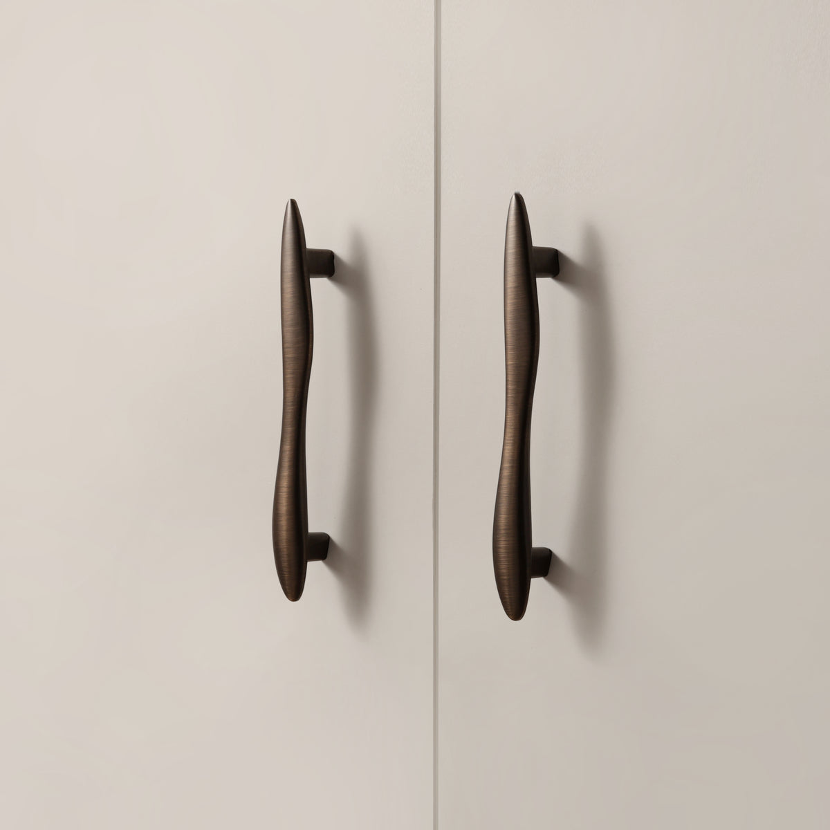 Maison Roma Handle in Antique Brushed Bronze installed on cabinet doors