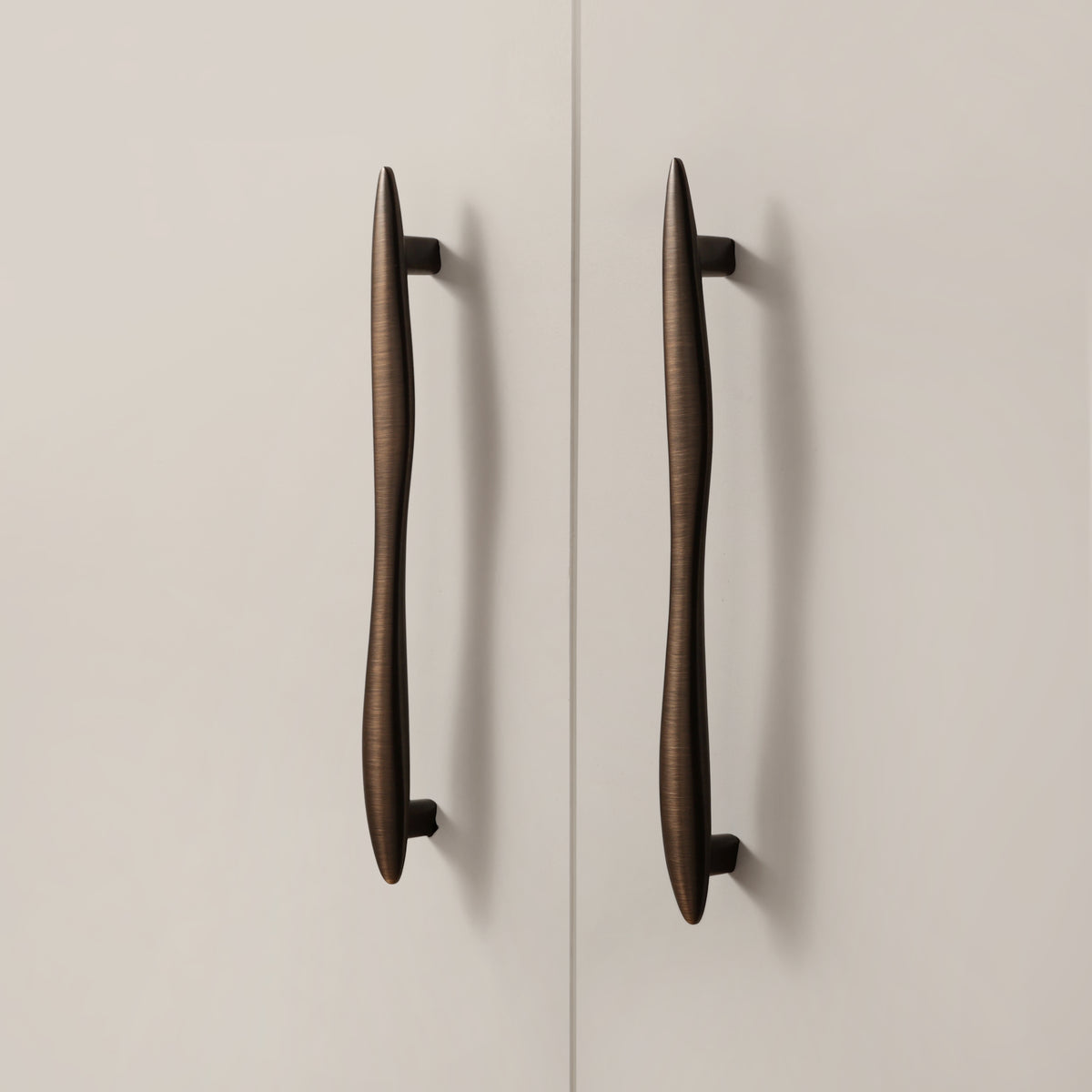 Maison Roma Handle in Antique Brushed Bronze installed on cabinet doors