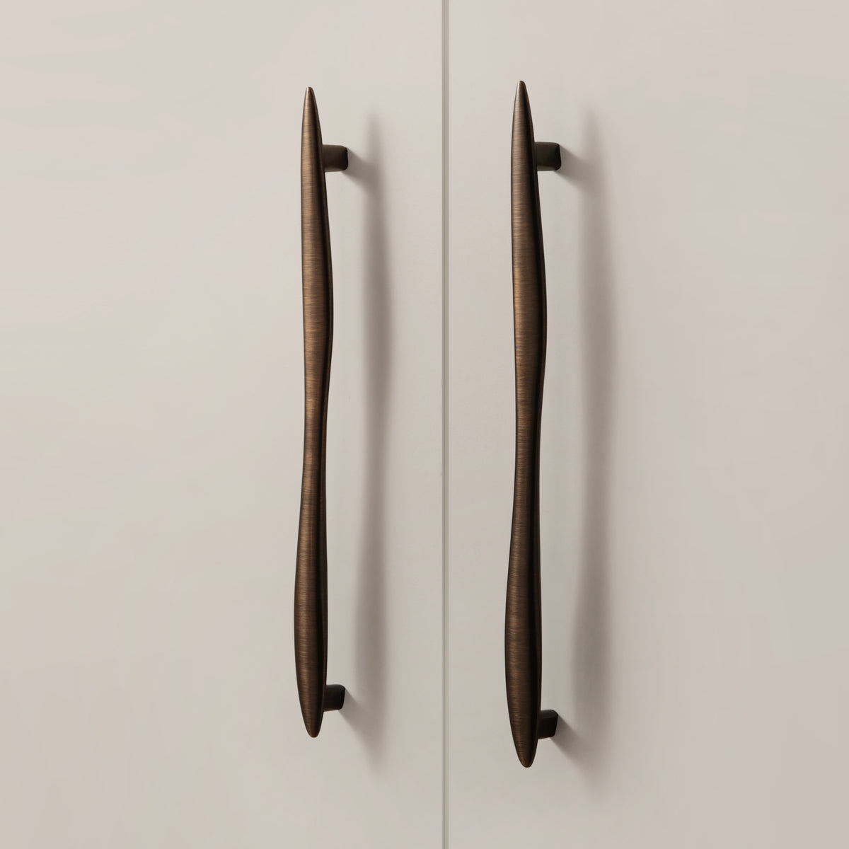 Maison Roma Handle in Antique Brushed Bronze installed on cabinet doors